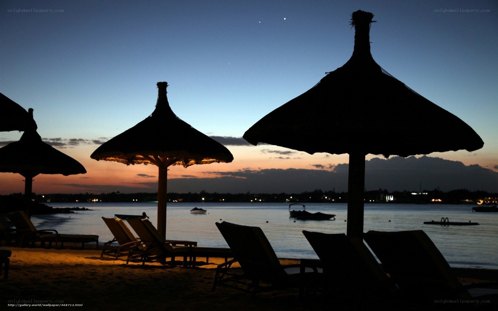 Beach umbrellas at dusk