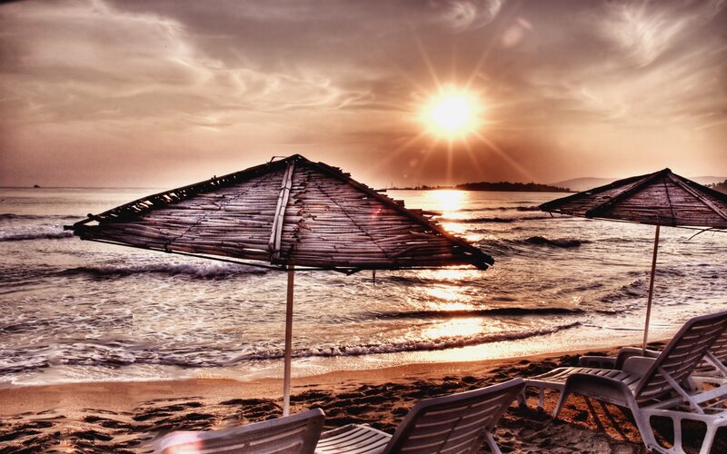 Beach Umbrellas at Sunset — Brown