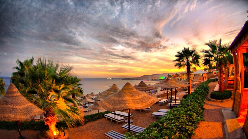 Beach Umbrellas at Sunset — Orange, Serene