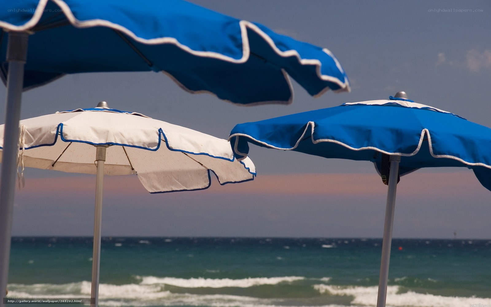 Beach umbrellas at sunset