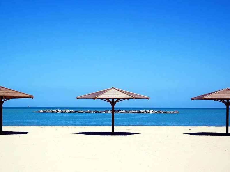 Beach Umbrellas on Sand — Blue