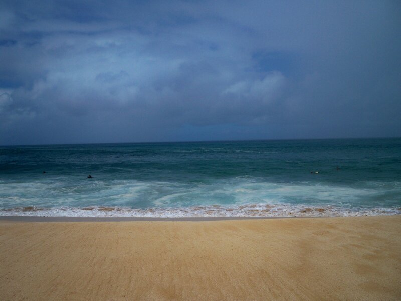 beach under cloudy sky