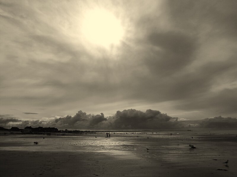 Beach under cloudy sky