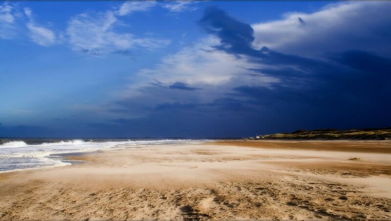 Beach under stormy sky