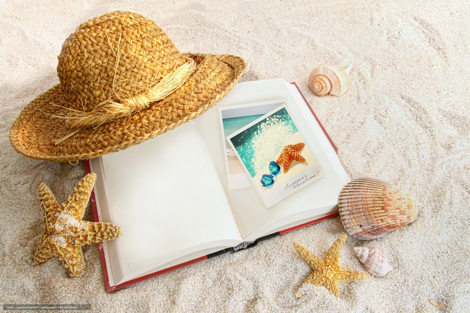 Beach vacation items on sand