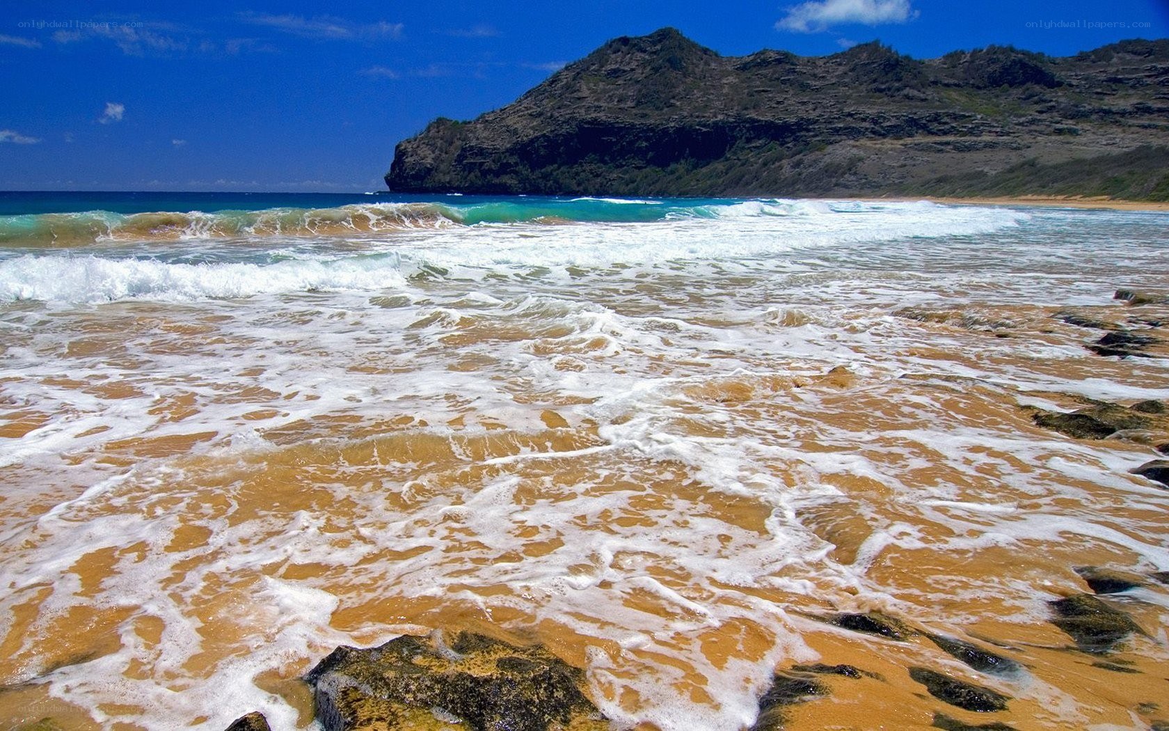 beach waves and rocky cliff