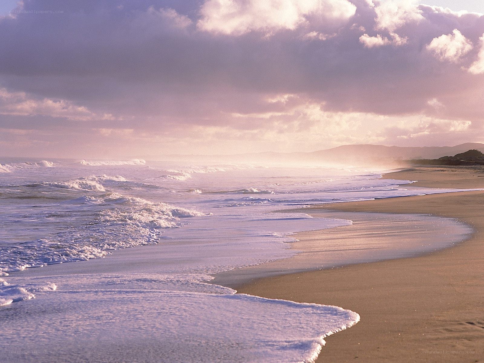 Beach waves at sunset
