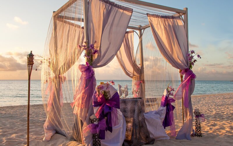 Beach Wedding Setup — Purple, Serene, Sunset
