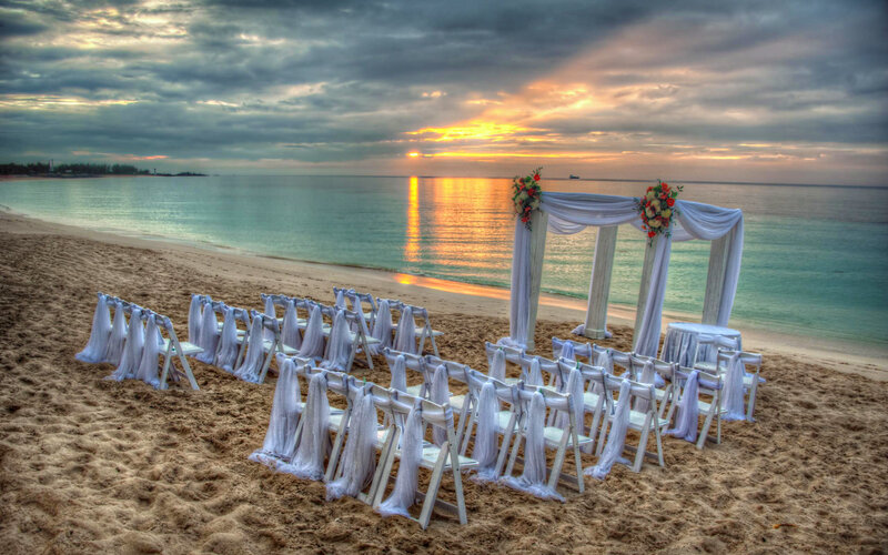 Beach Wedding Setup — White, Serene, Sunset