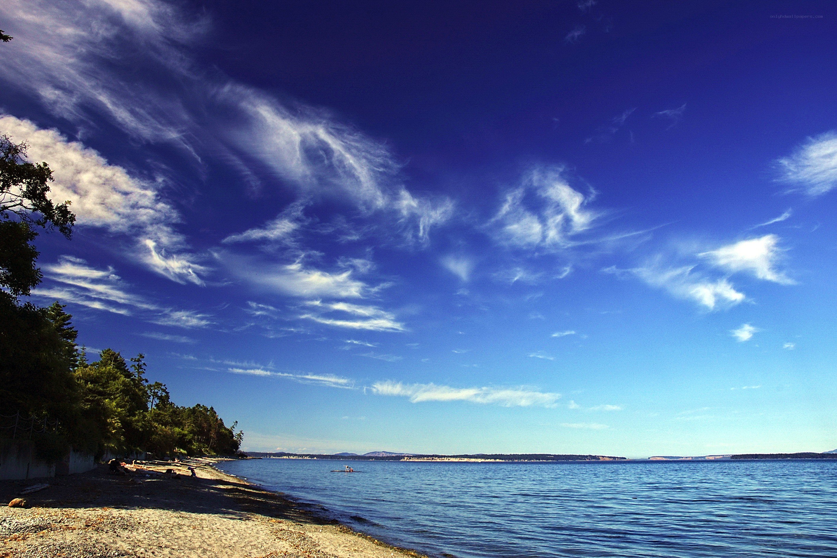 Beach with blue sky and clouds