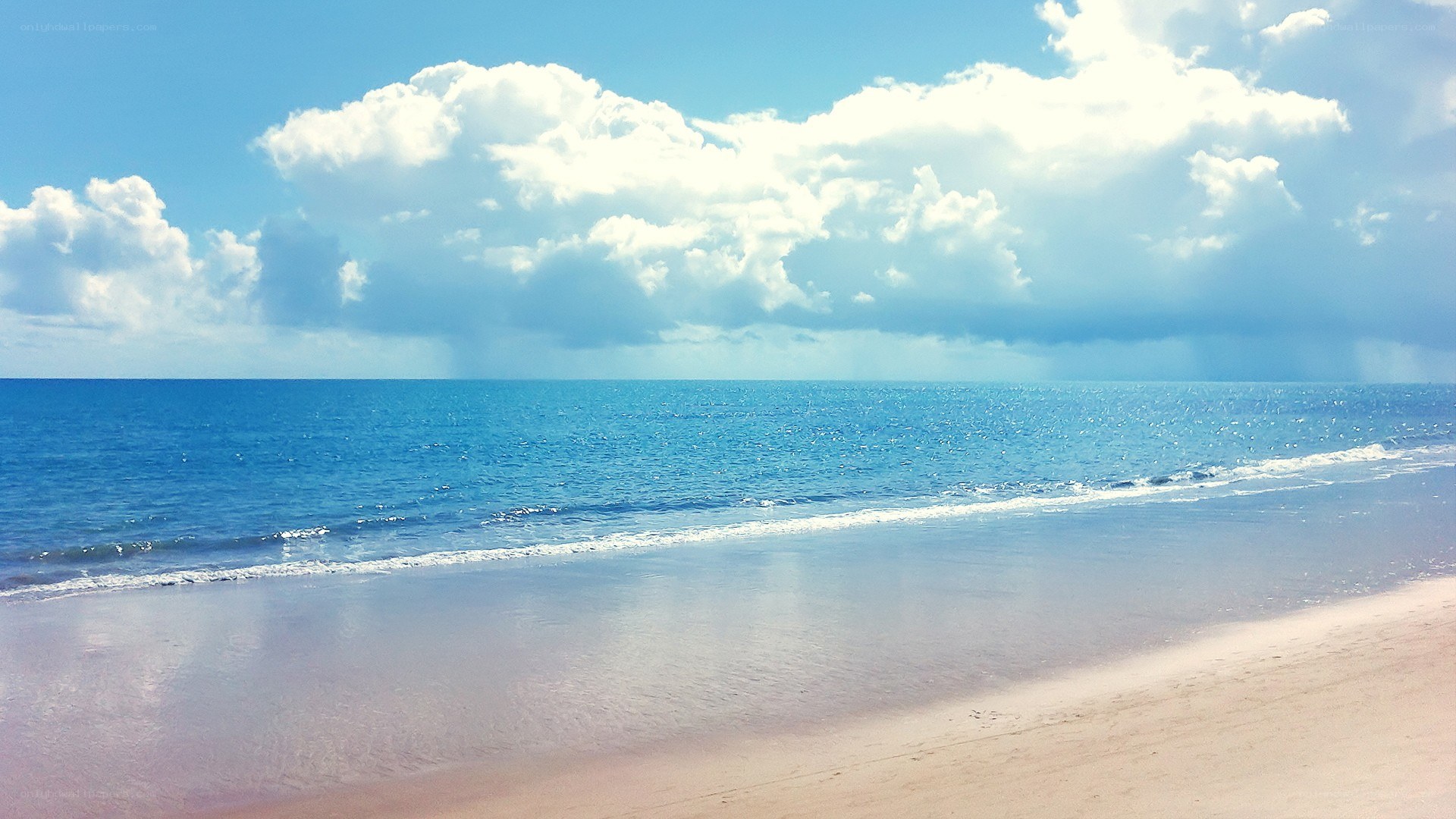 Beach with blue sky and clouds