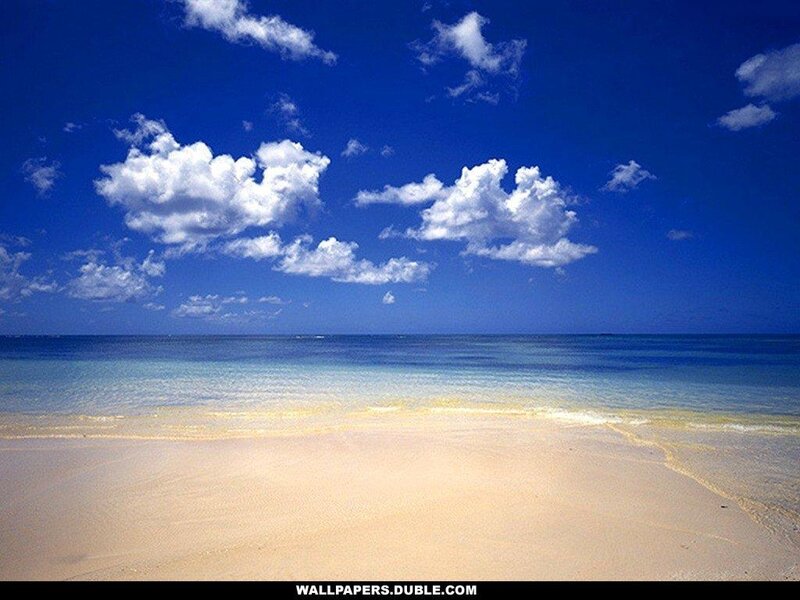 Beach with blue sky and clouds