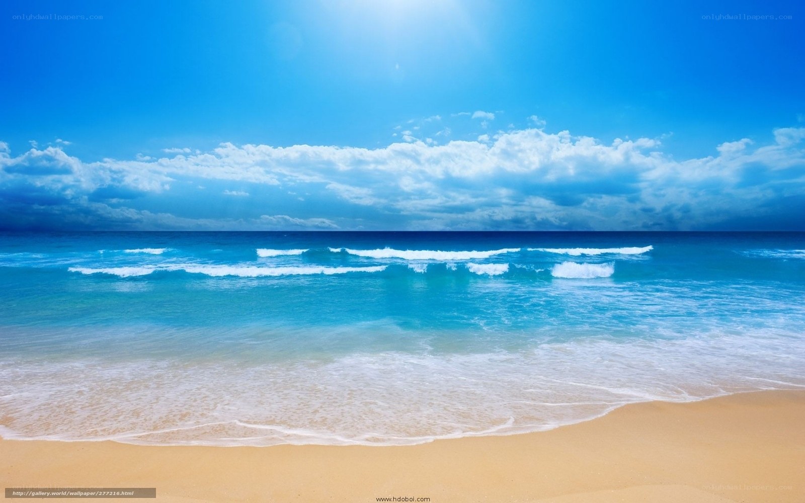 Beach with blue sky and waves