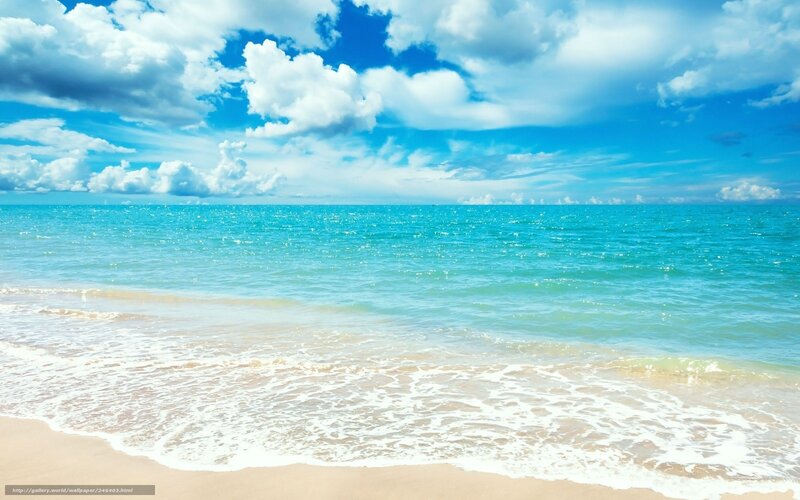 Beach with blue sky and waves
