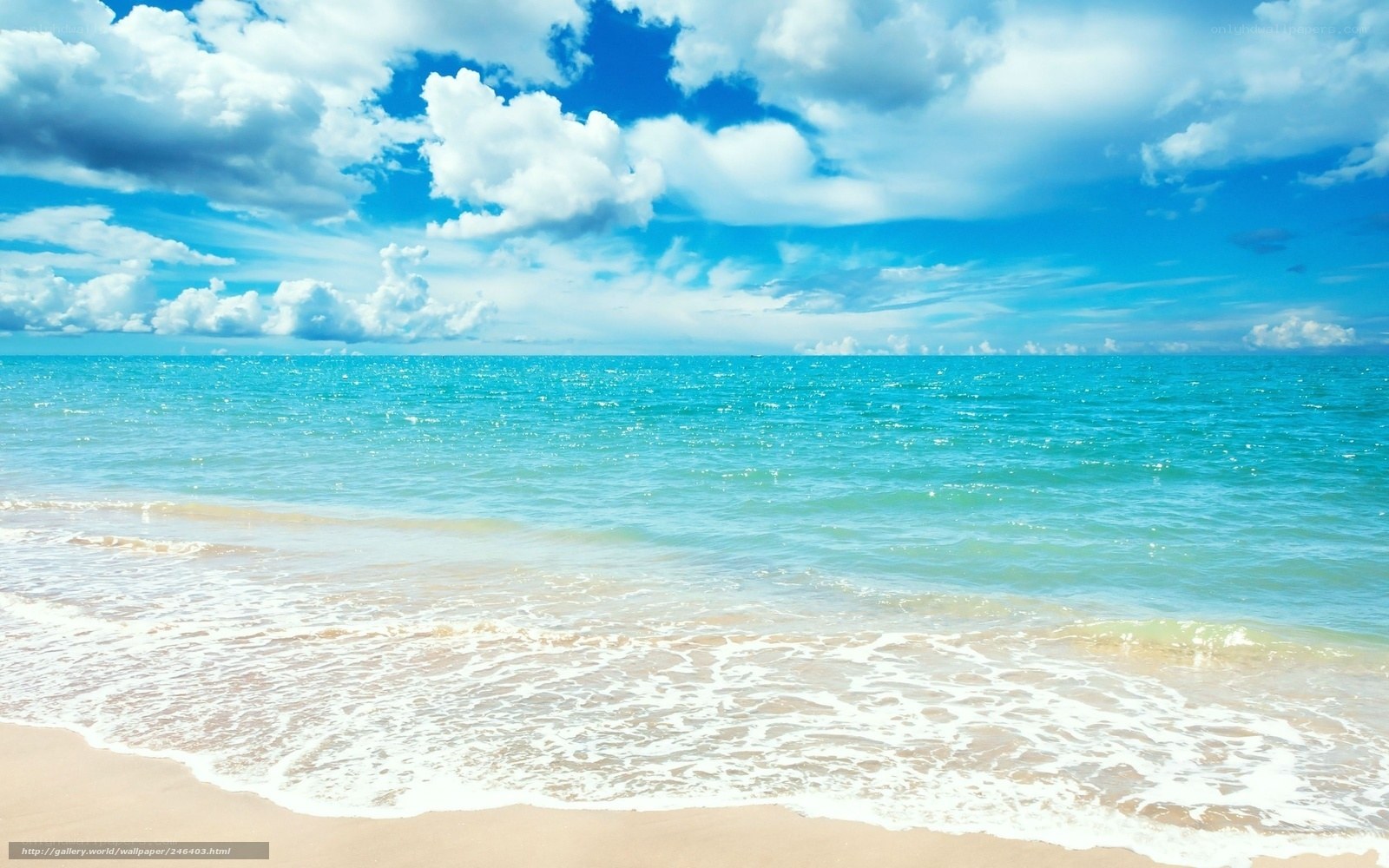 Beach with blue sky and waves
