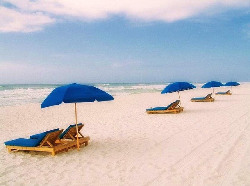 Beach with blue umbrellas