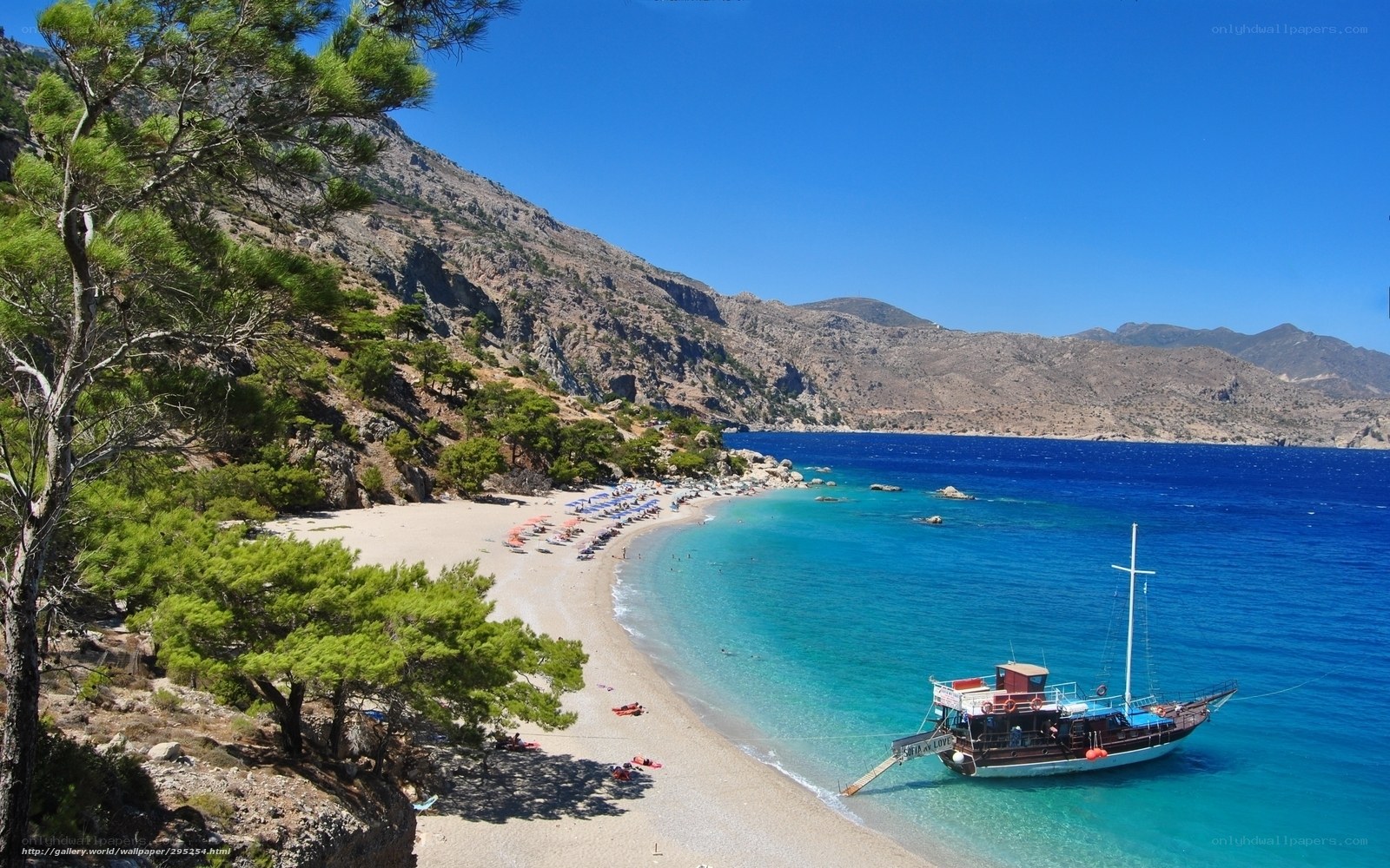 Beach with boat and mountains
