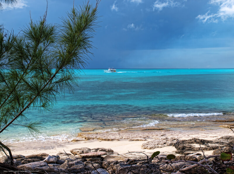 Beach with boat in turquoise water