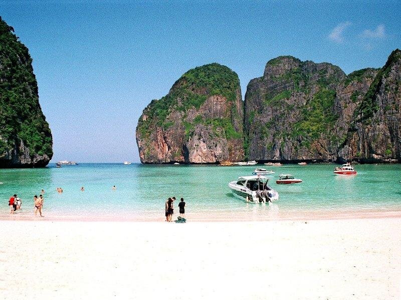 Beach with Boats and Cliffs