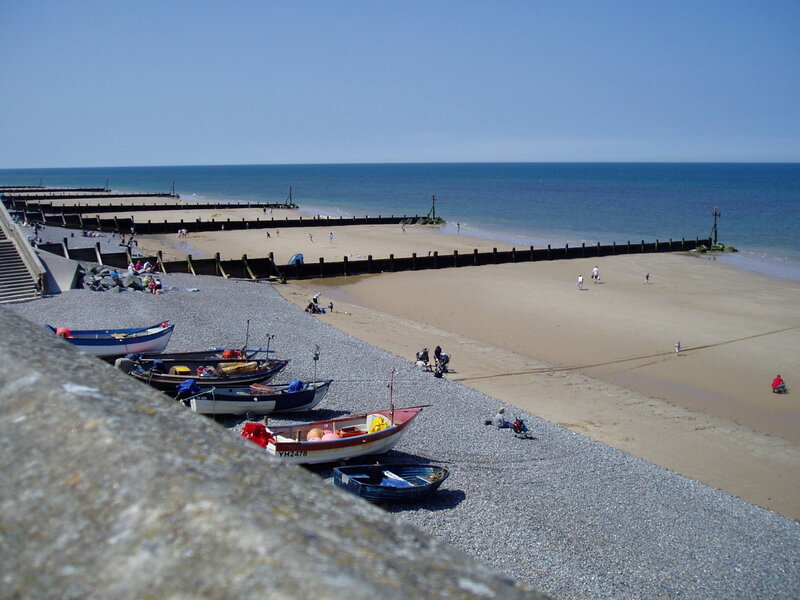 Beach with boats and piers