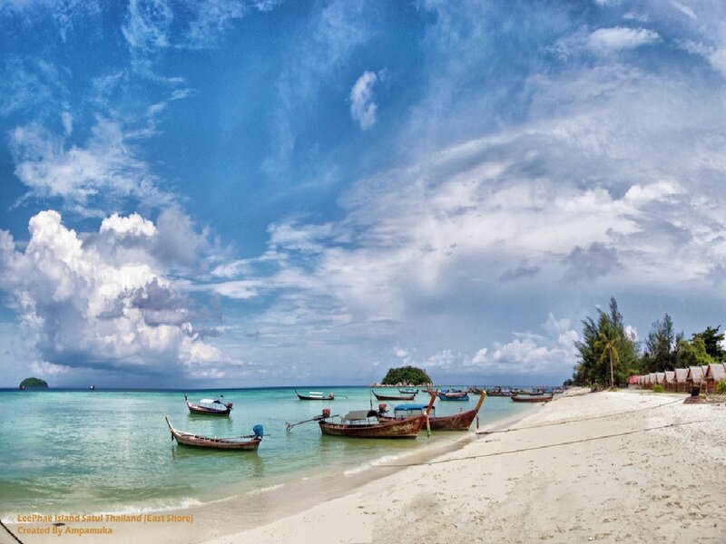 Beach with boats in Thailand