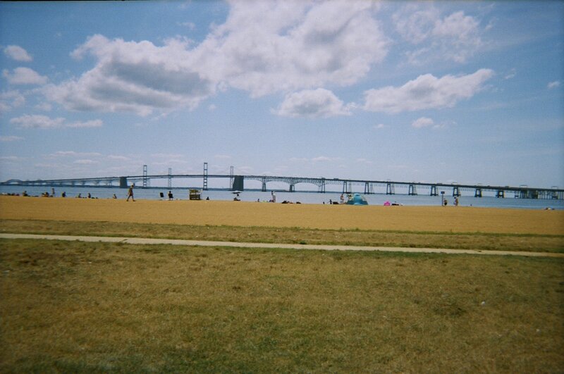 beach with bridge in background