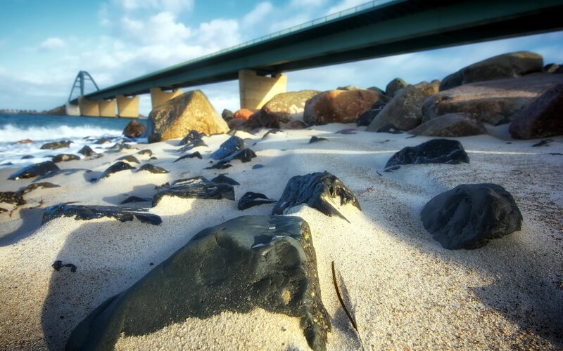 Beach with bridge in background