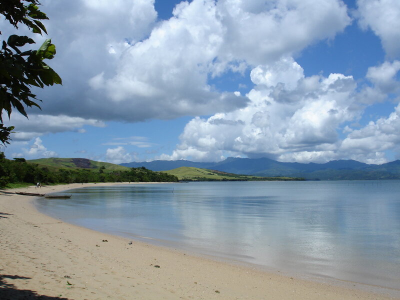 Beach with Calm Water — Blue, Serene, Afternoon