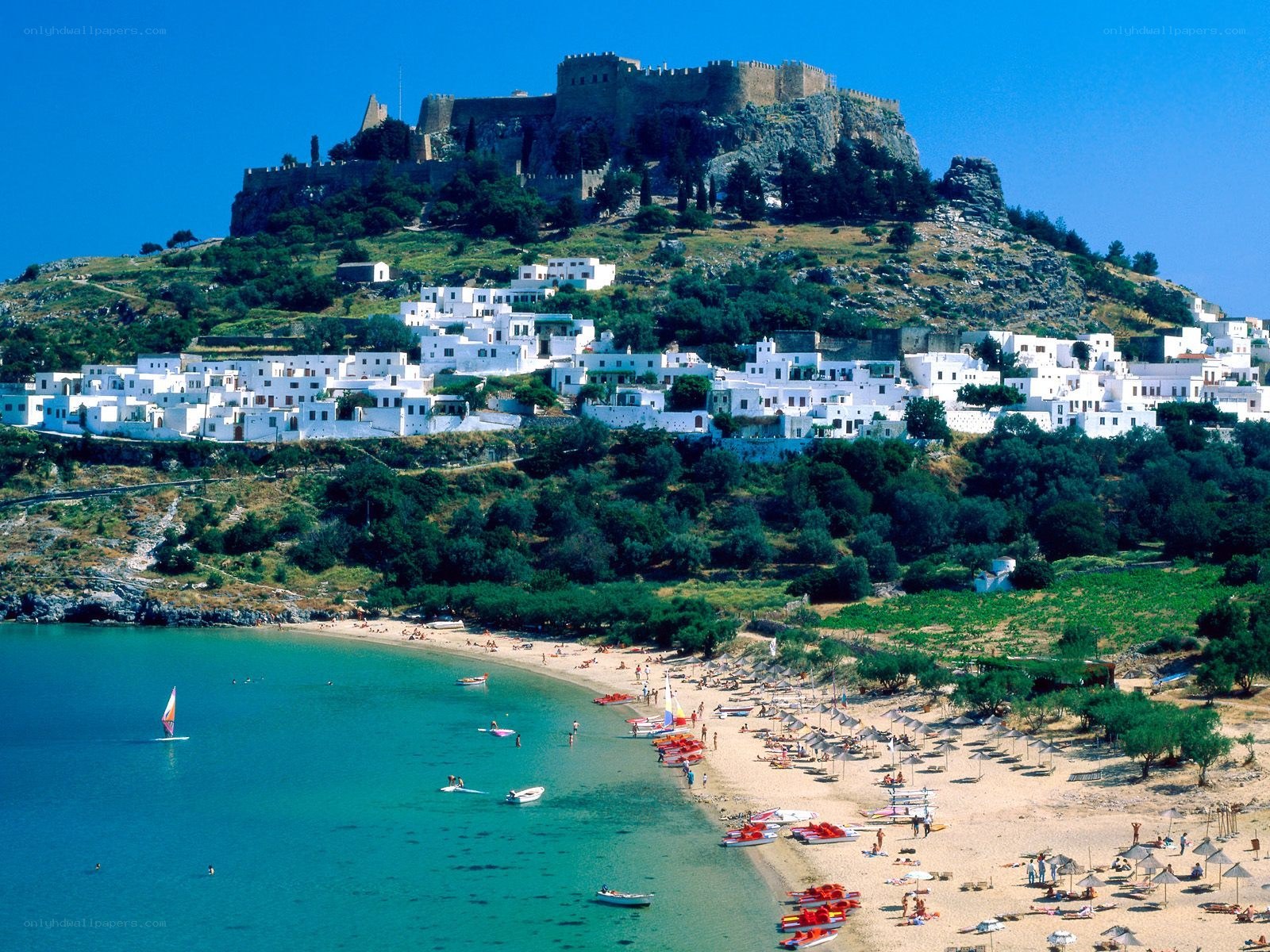 Beach with castle on hill