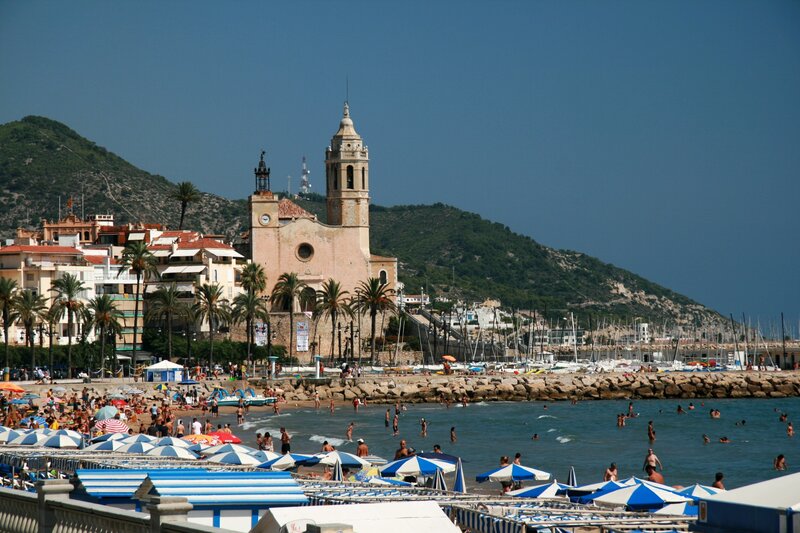 Beach with church and mountains