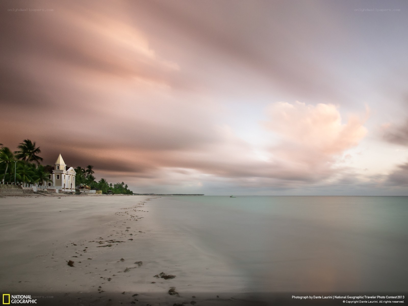 Beach with church at sunset