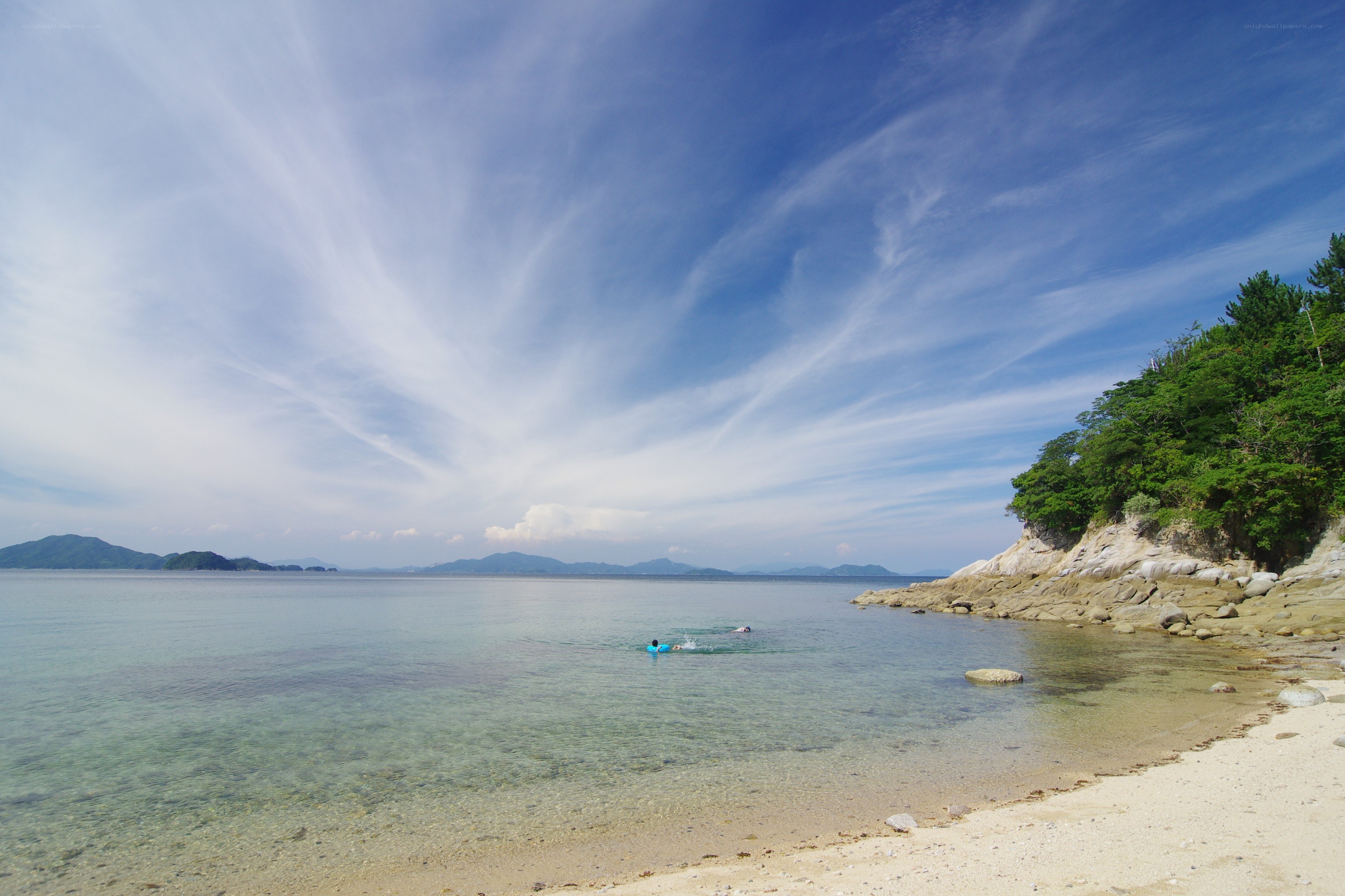 Beach with clear water and blue sky