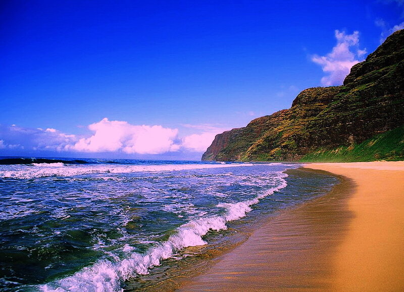 beach with cliffs and blue sky