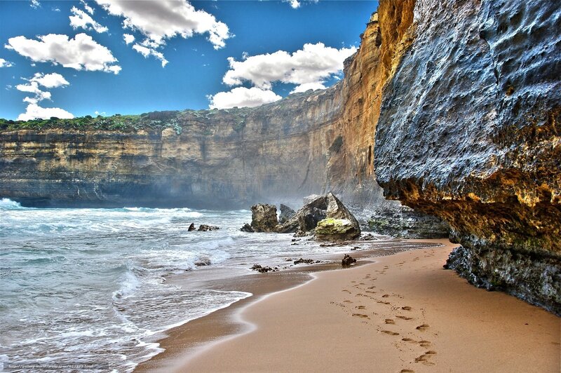 Beach with Cliffs and Footprints