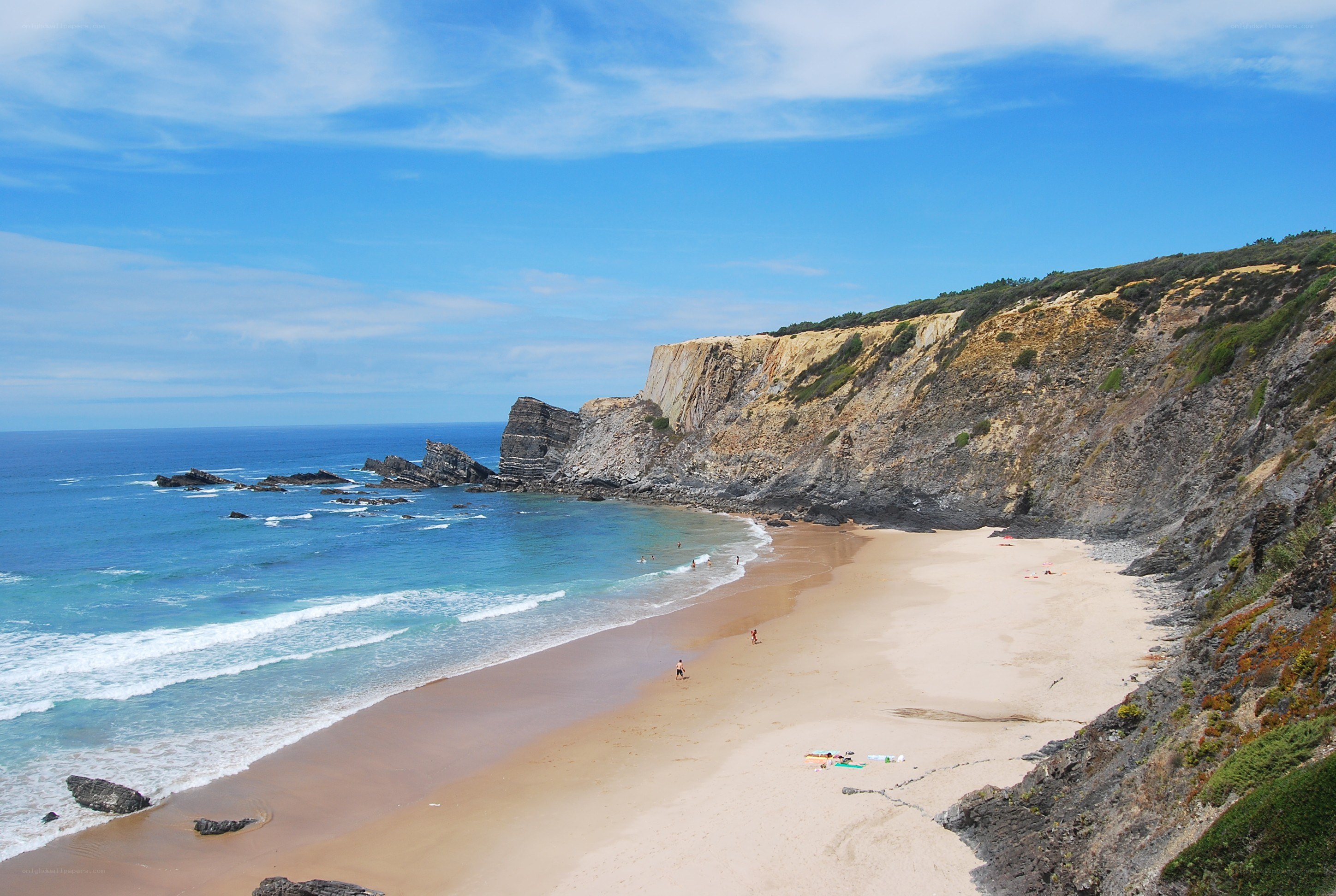beach with cliffs and ocean