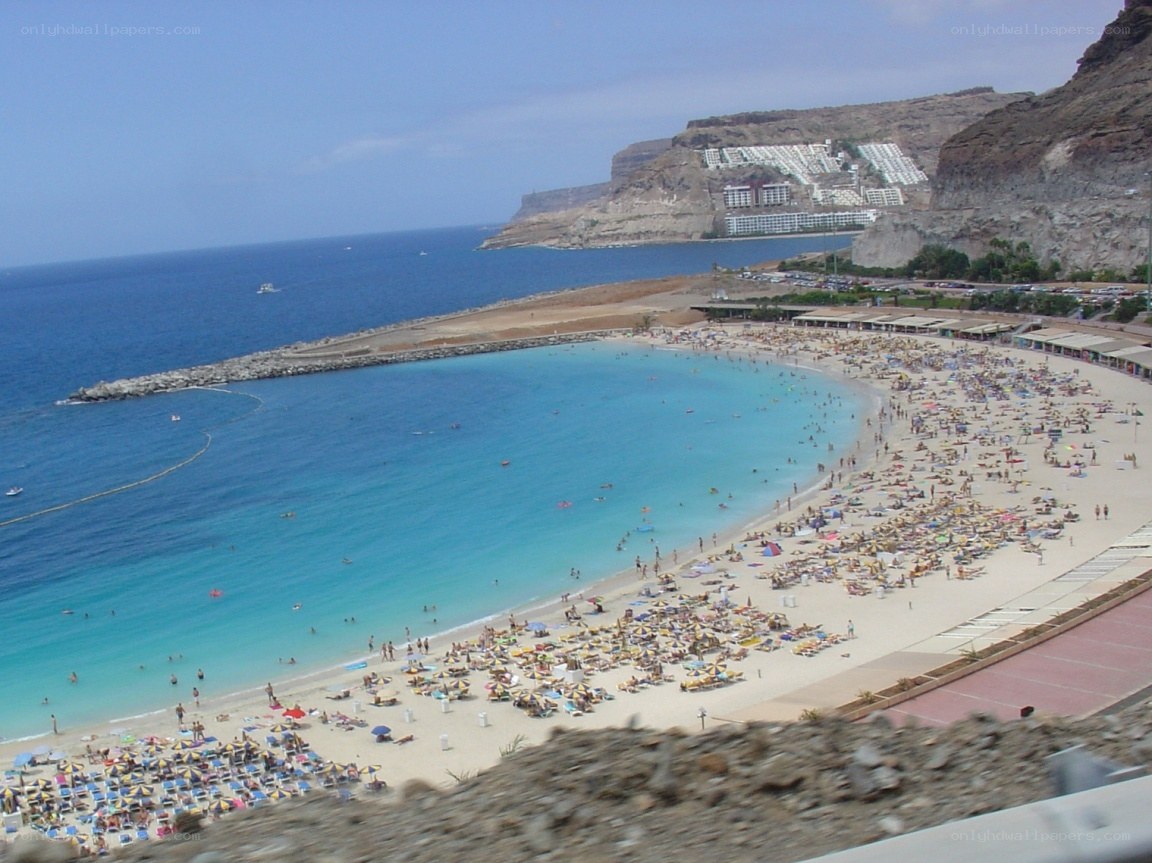 beach with cliffs and resort