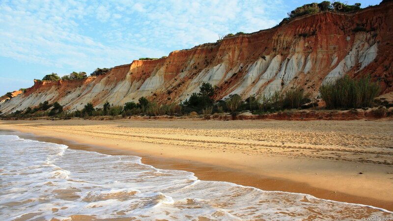 beach with cliffs at sunset
