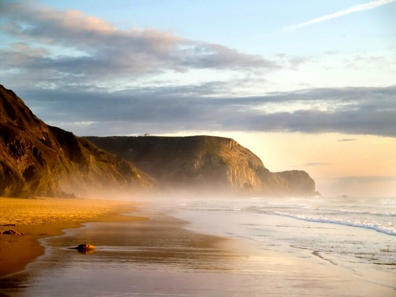 Beach with Cliffs at Sunset — Blue