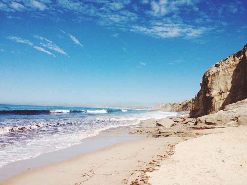 Beach with Cliffs — Blue, Serene, Afternoon, Photograph, Ocean