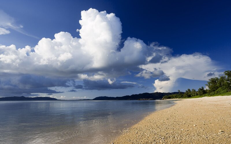 Beach with clouds and mountains