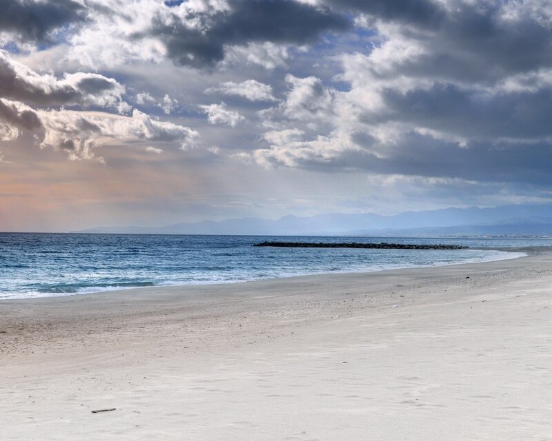 Beach with cloudy sky
