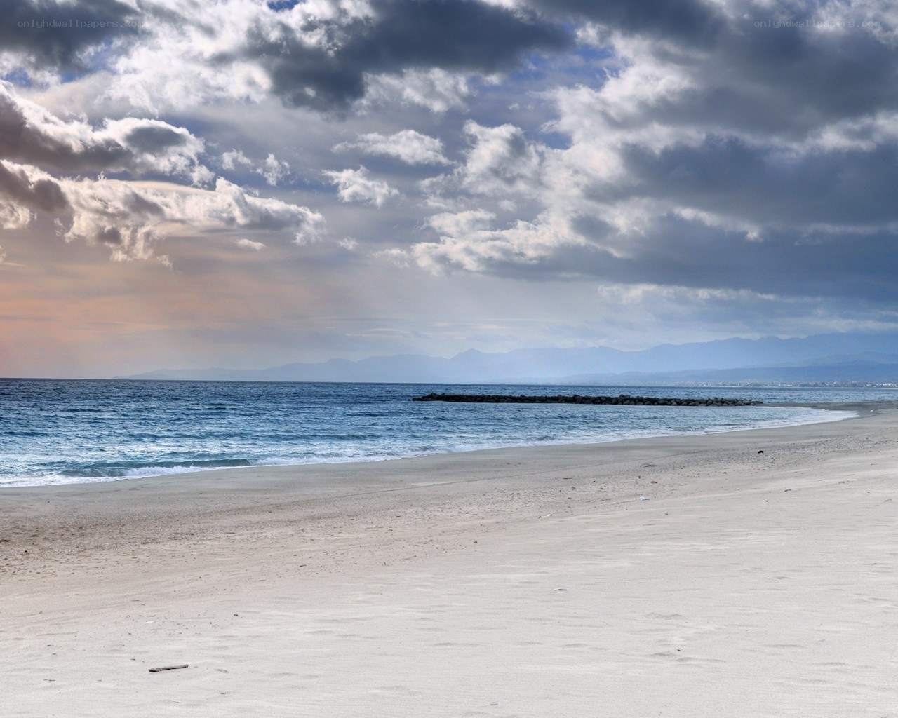 Beach with cloudy sky