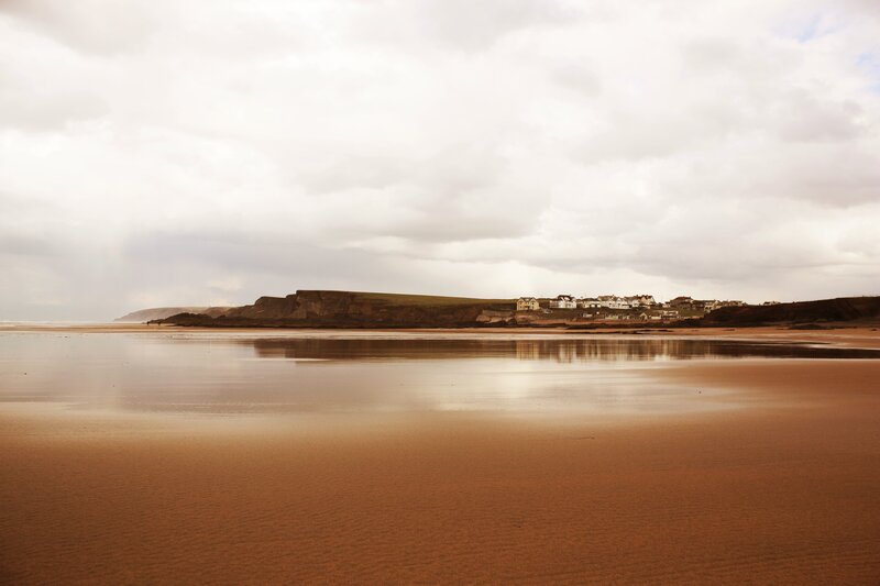 Beach with Coastal Village — Brown