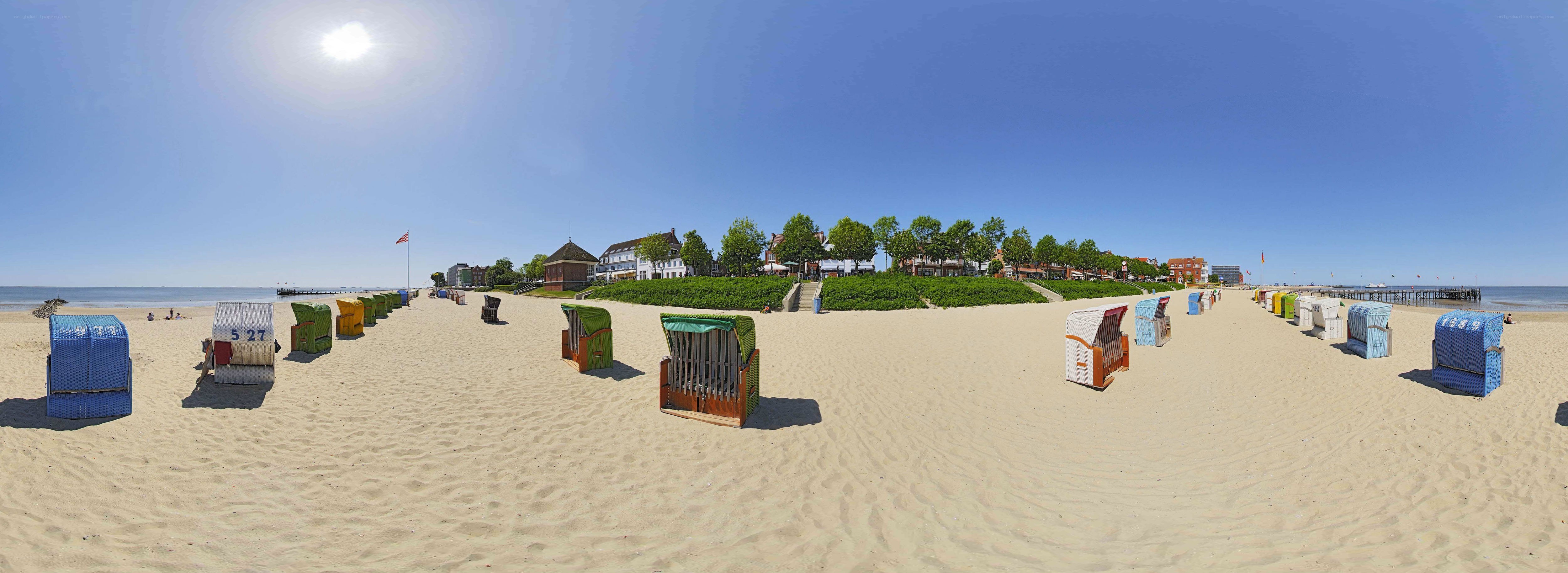 beach with colorful chairs