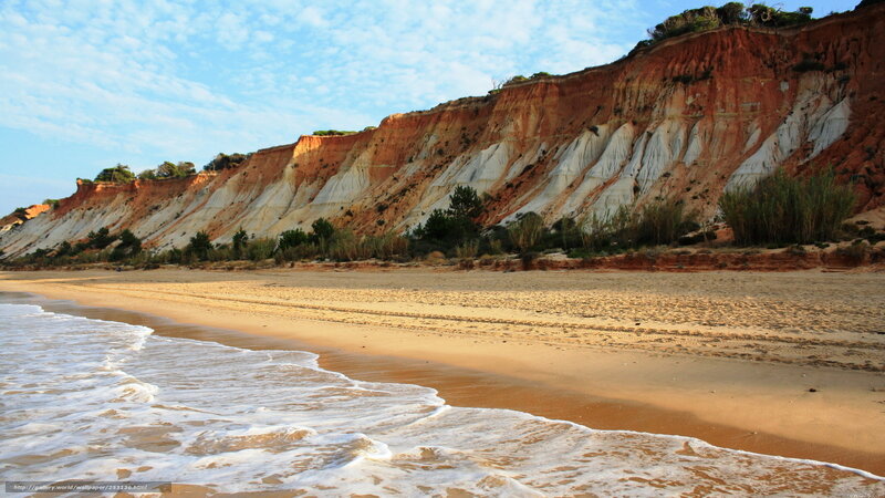 beach with colorful cliffs