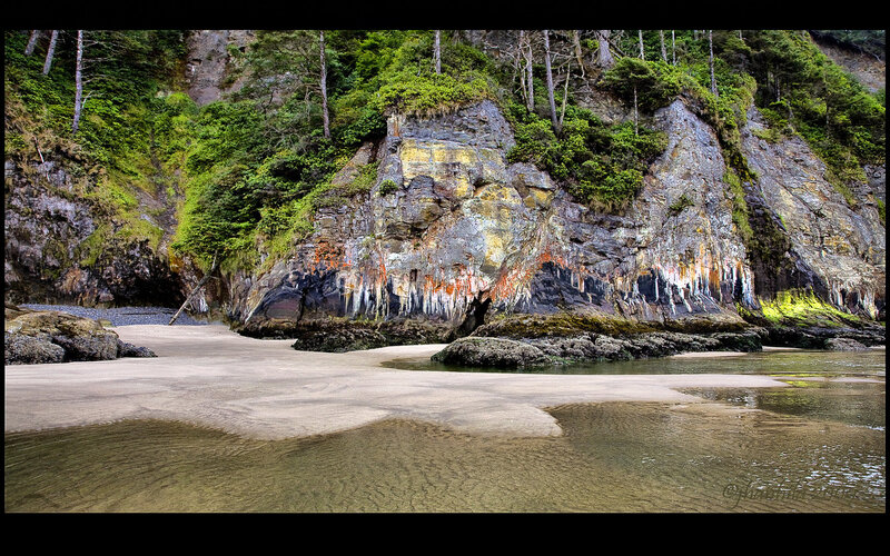 beach with colorful rock formations