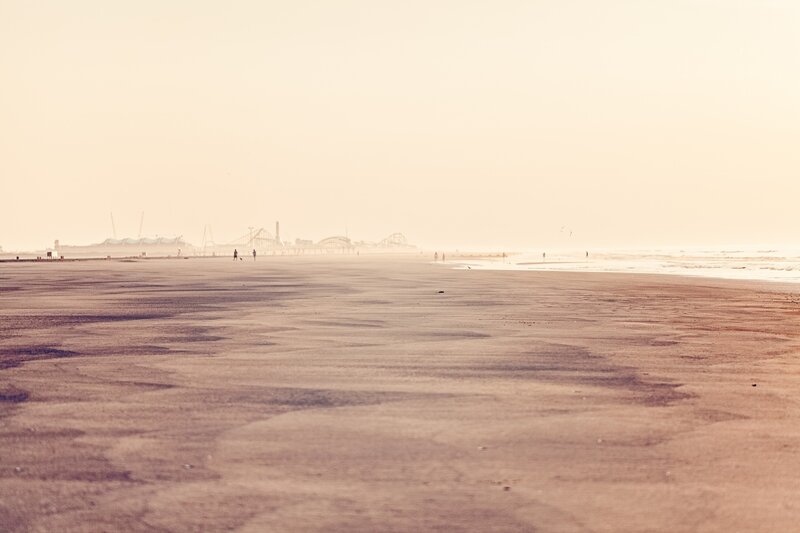 beach with distant amusement park