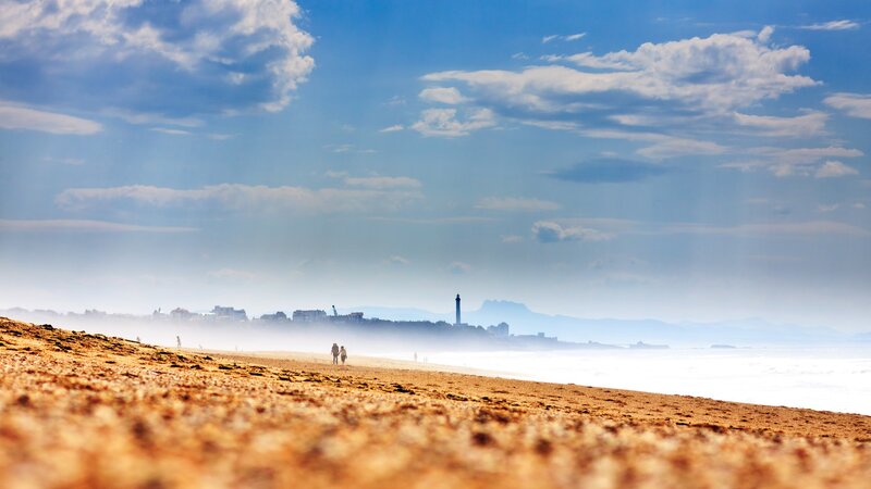 Beach with distant city view