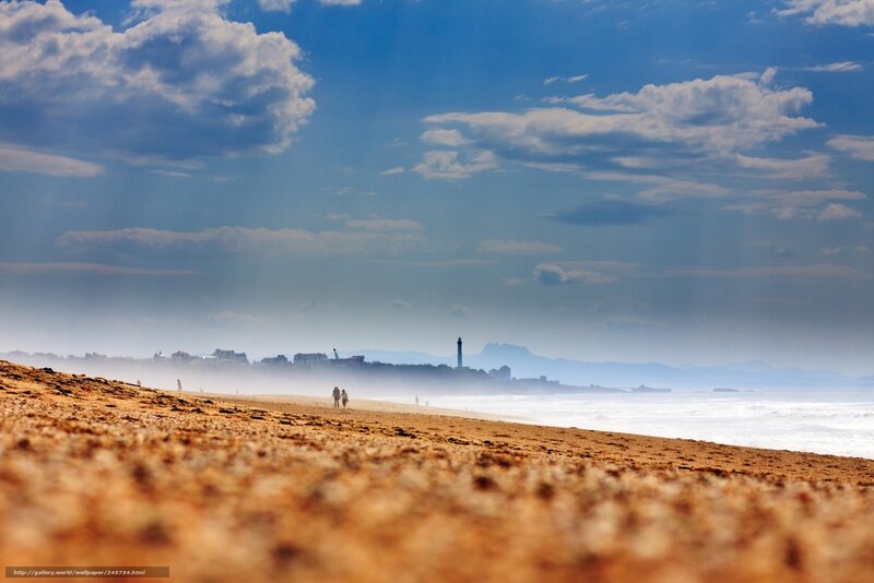 Beach with distant lighthouse