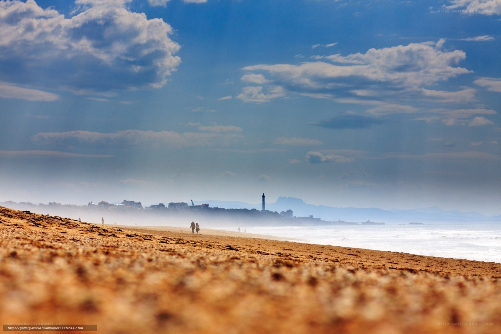 Beach with distant lighthouse